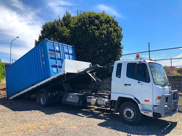 storage container on the back of a removal truck