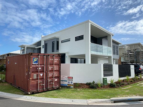 shipping container stored offsite on residential building site